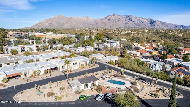 birds eye view of property with a mountain view