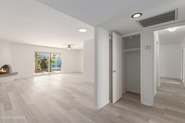 hall with light hardwood / wood-style flooring