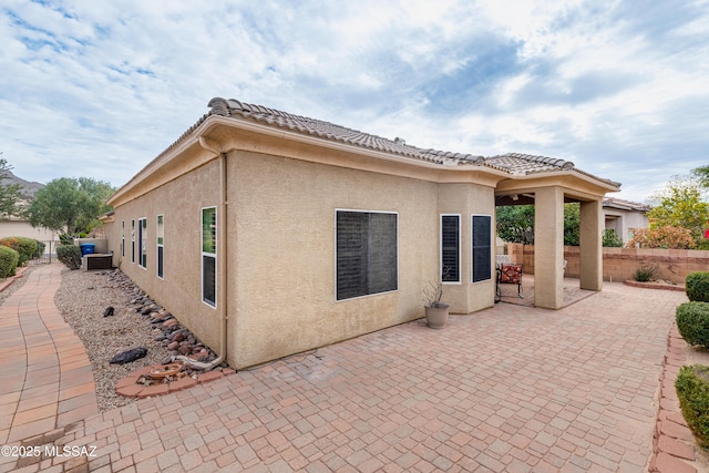 back of house with a patio area