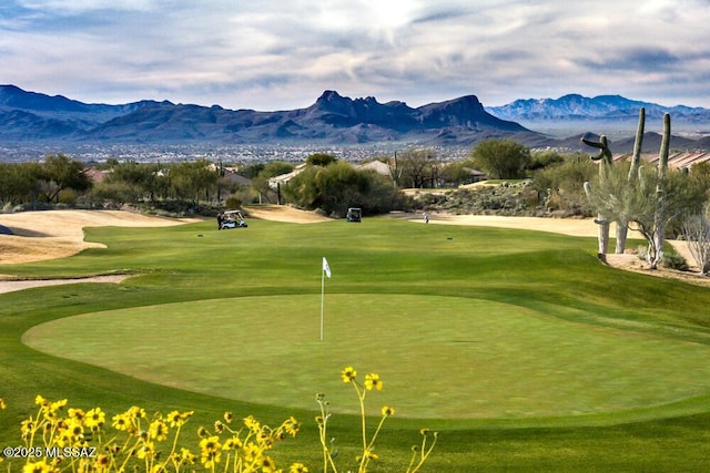 surrounding community with a mountain view