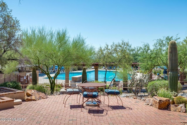 view of patio with a community pool