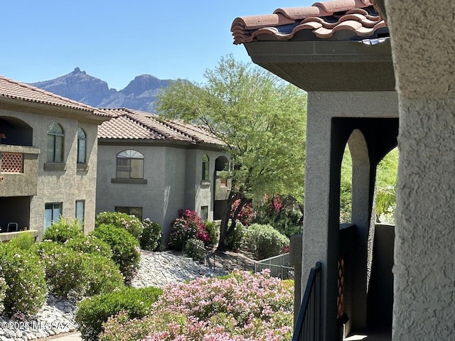 view of side of home featuring a mountain view