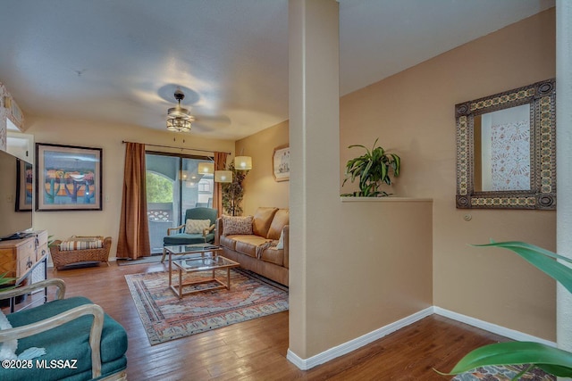 living room with hardwood / wood-style floors and ceiling fan