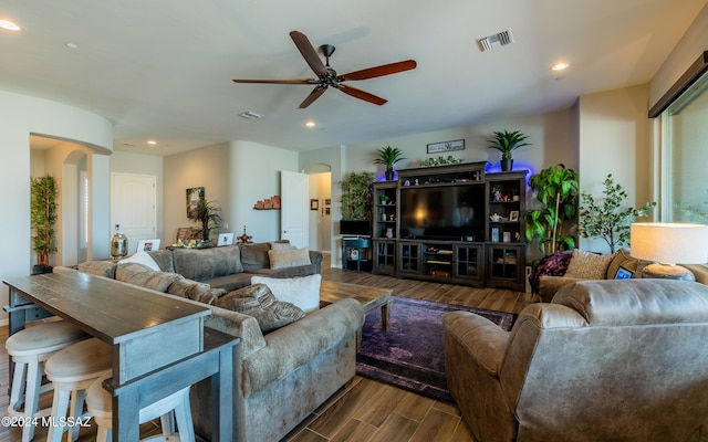 living room featuring hardwood / wood-style flooring and ceiling fan