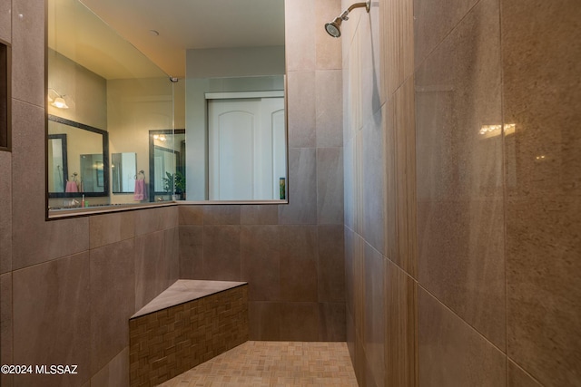 bathroom featuring a tile shower