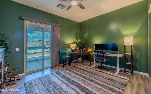 office with ceiling fan and wood-type flooring