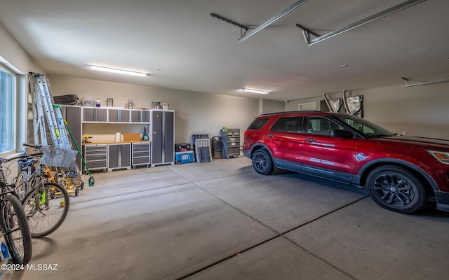 garage featuring heating unit and gas water heater