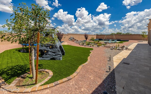 view of yard featuring a trampoline