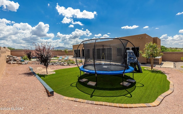 view of yard featuring a trampoline