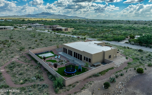 birds eye view of property with a mountain view