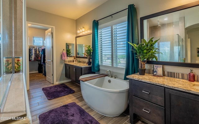 bathroom featuring vanity and a bathing tub