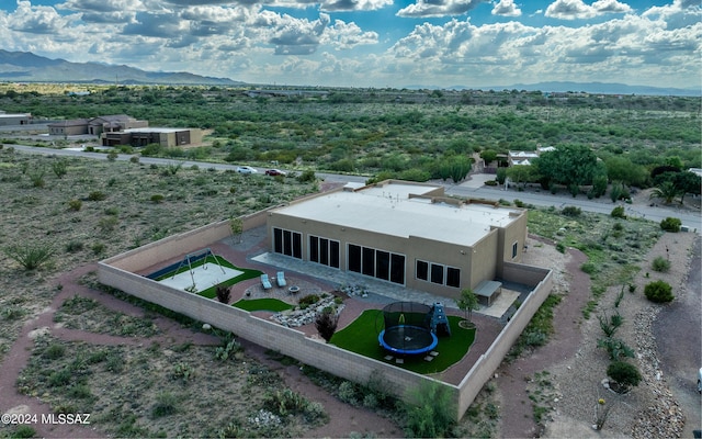 birds eye view of property with a mountain view