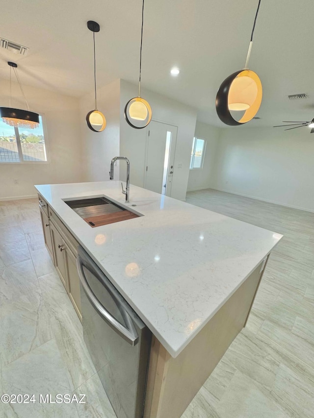 kitchen with dishwasher, a kitchen island with sink, hanging light fixtures, and sink