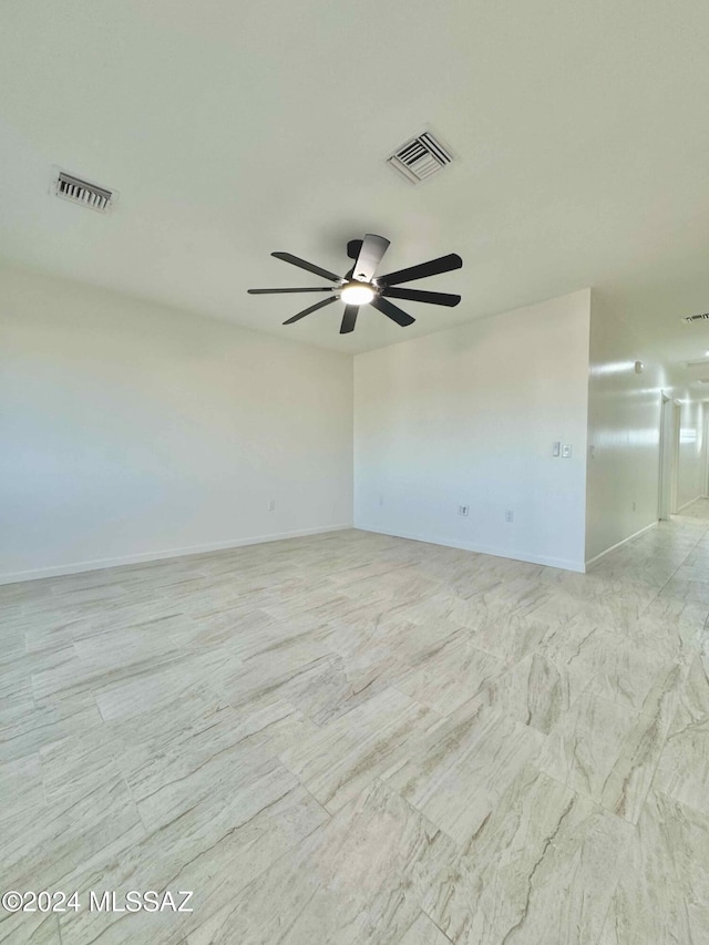 spare room with ceiling fan