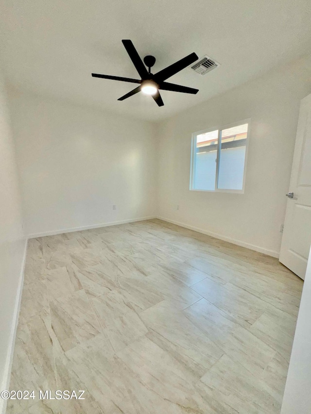 unfurnished room featuring ceiling fan