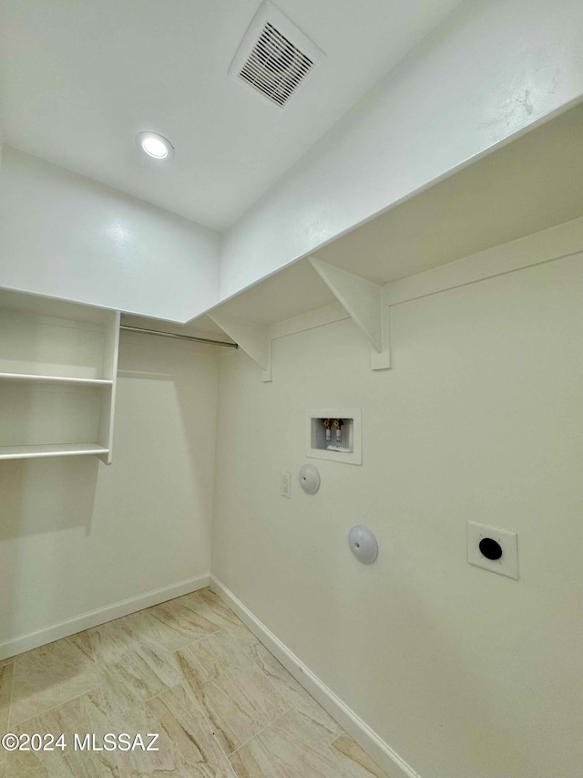 laundry area featuring hookup for a gas dryer, washer hookup, and hookup for an electric dryer