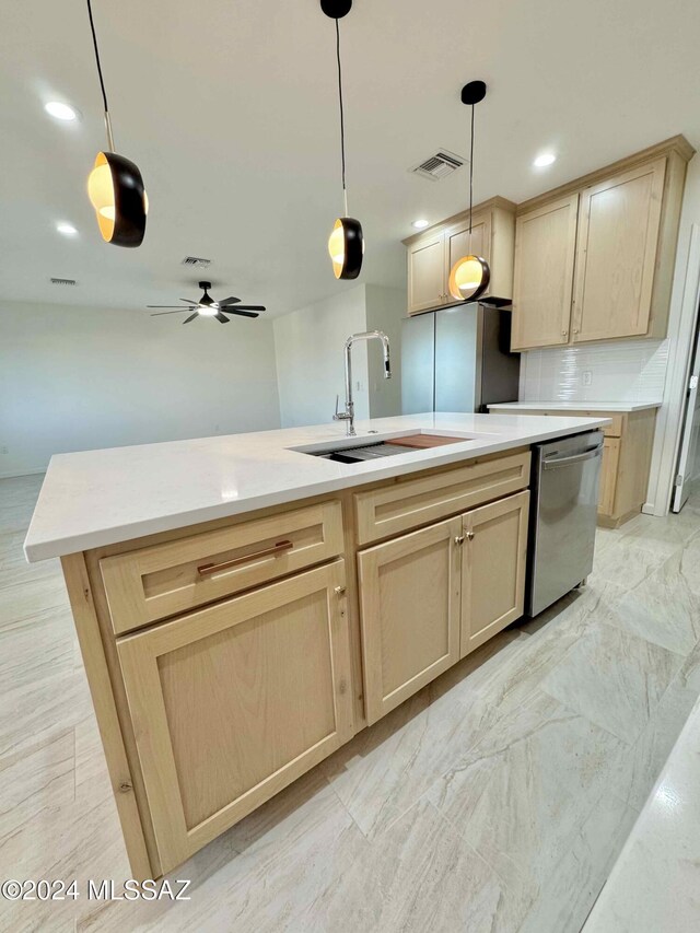 kitchen with sink, light brown cabinetry, and appliances with stainless steel finishes