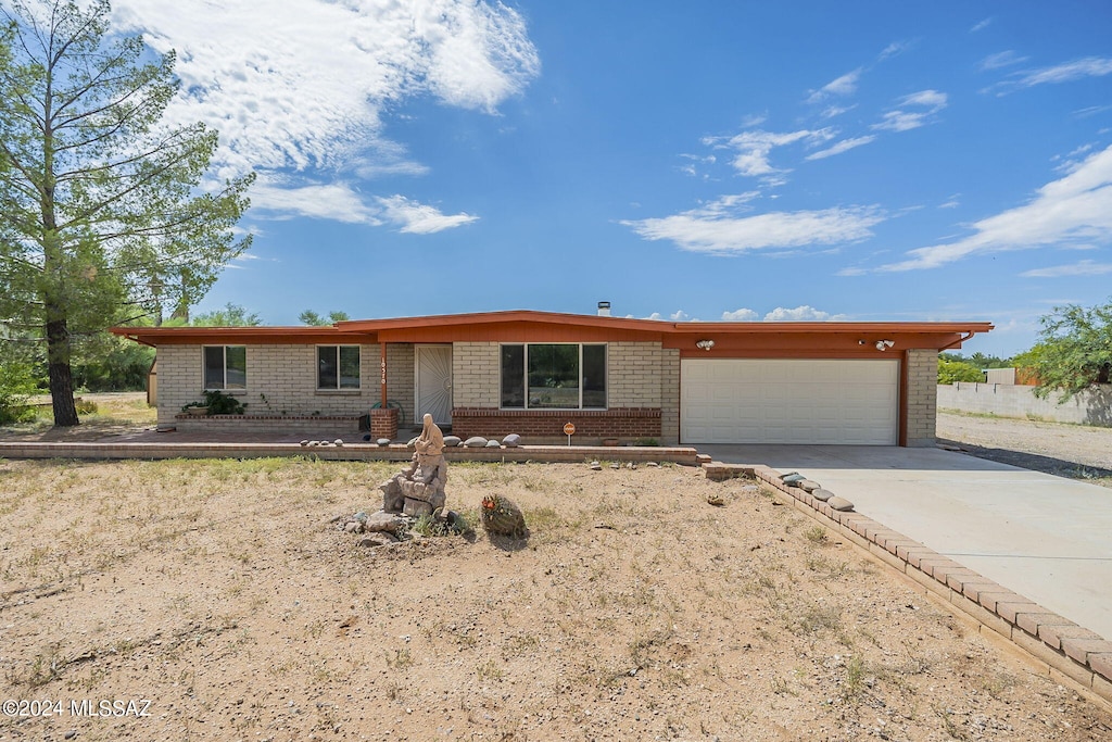 ranch-style house featuring a garage