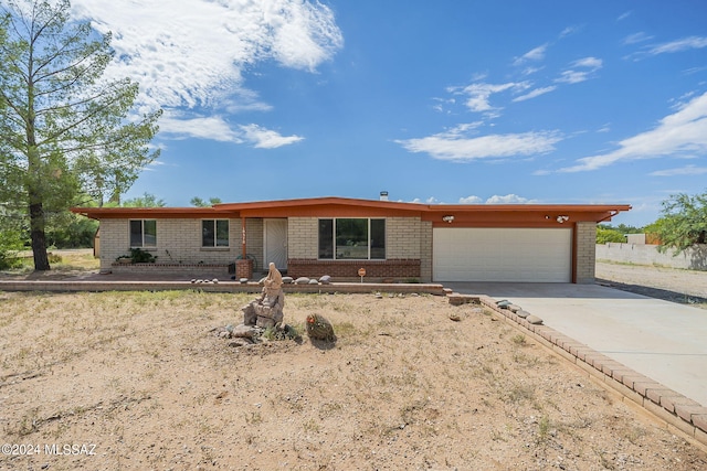 ranch-style house featuring a garage