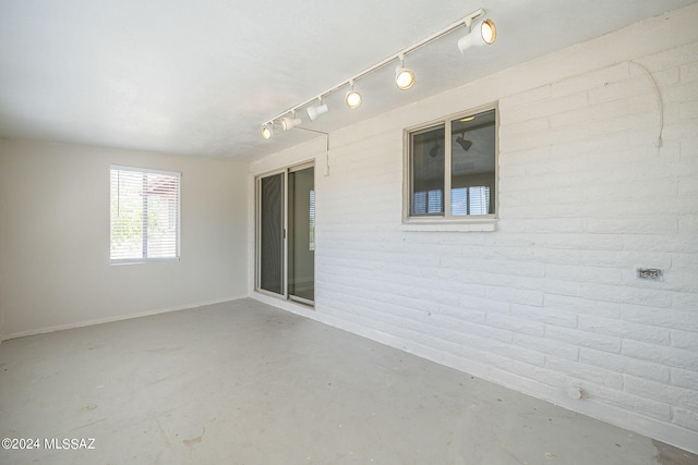 unfurnished room featuring concrete flooring