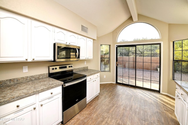 kitchen with white cabinetry, light hardwood / wood-style floors, and appliances with stainless steel finishes