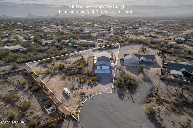 birds eye view of property featuring a mountain view