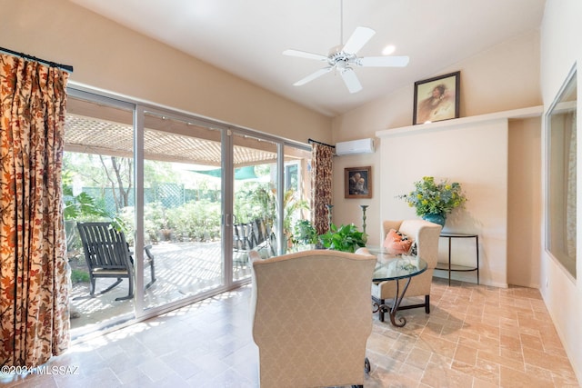 sitting room featuring ceiling fan, a wall unit AC, and vaulted ceiling