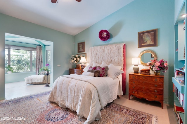 bedroom with ceiling fan and lofted ceiling