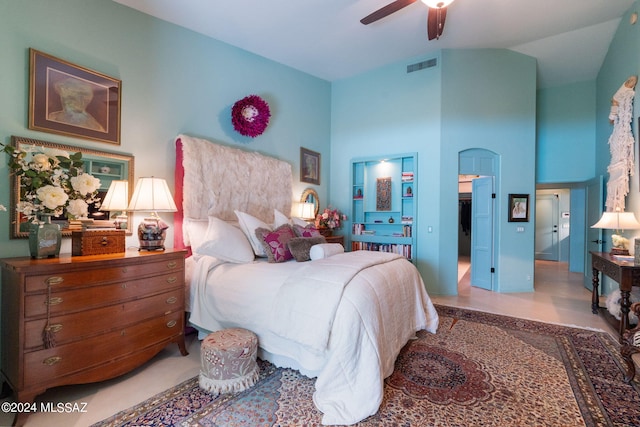 bedroom with ceiling fan and high vaulted ceiling