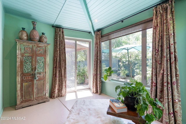 sunroom / solarium featuring wood ceiling