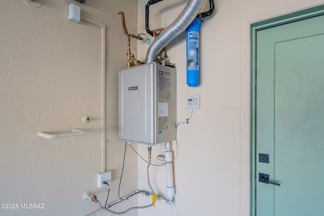 utility room with tankless water heater