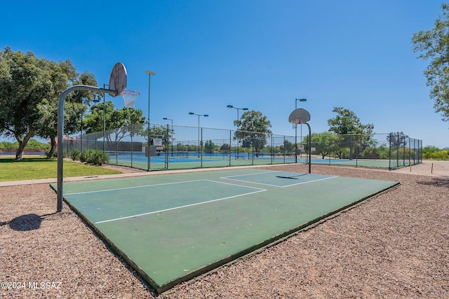 view of basketball court featuring tennis court