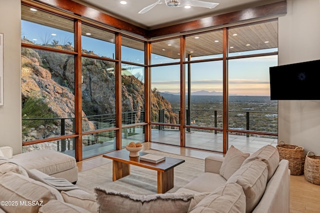 sunroom with ceiling fan