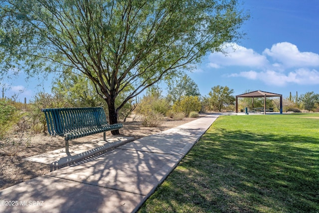 view of property's community with a gazebo and a yard