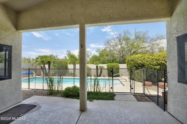 view of swimming pool with a patio area