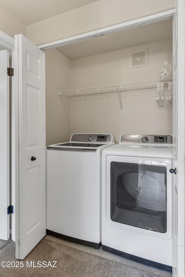 washroom with carpet and washing machine and dryer