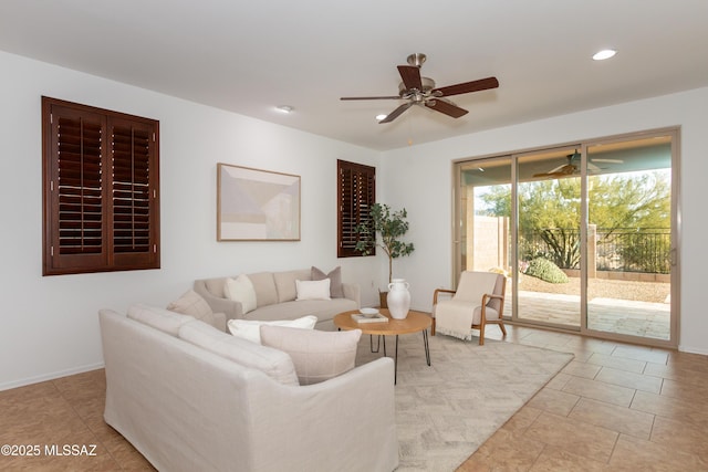 tiled living room featuring ceiling fan