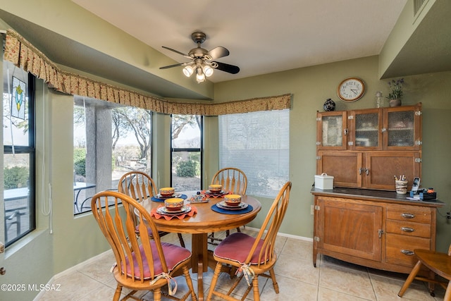 tiled dining room with ceiling fan