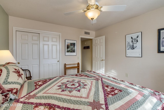 bedroom with ceiling fan and a closet