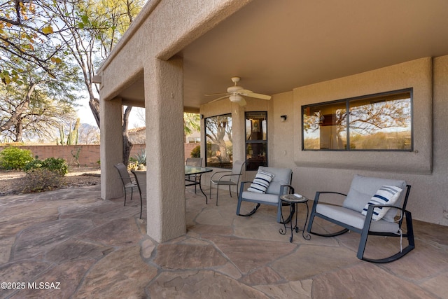 view of patio featuring ceiling fan