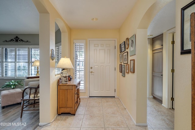 tiled entryway with a wealth of natural light