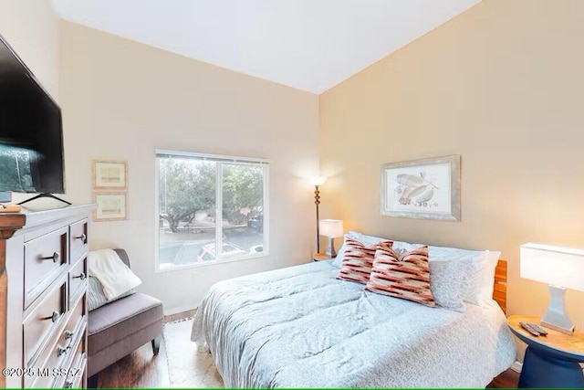 bedroom featuring lofted ceiling