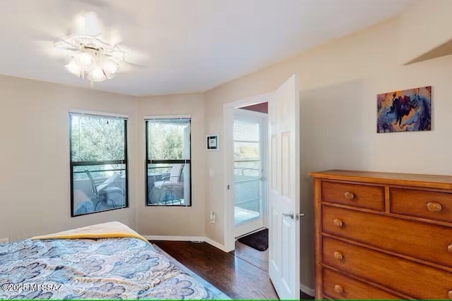 bedroom featuring ceiling fan and dark hardwood / wood-style flooring