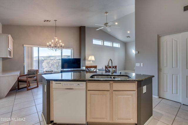 kitchen with white dishwasher, a center island with sink, lofted ceiling, and sink