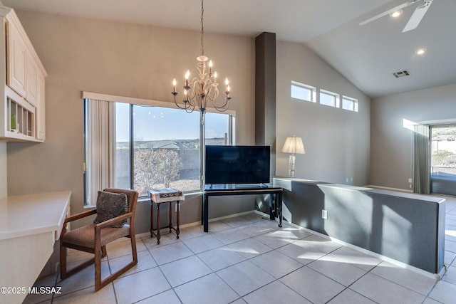 interior space featuring ceiling fan with notable chandelier and lofted ceiling