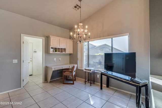 kitchen featuring light tile patterned floors, decorative light fixtures, lofted ceiling, and a notable chandelier