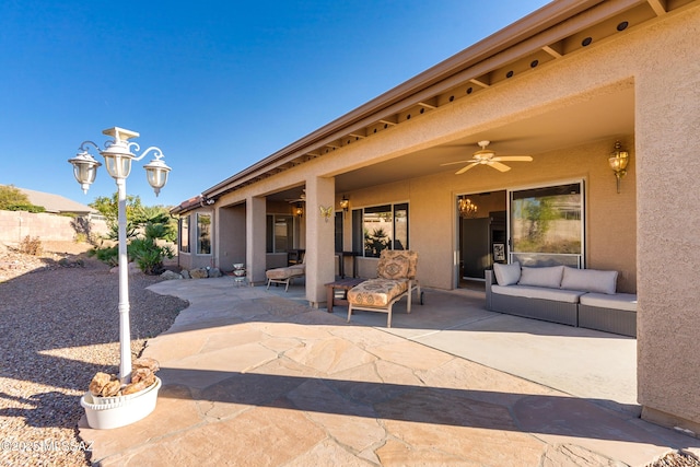 view of patio with ceiling fan and an outdoor hangout area