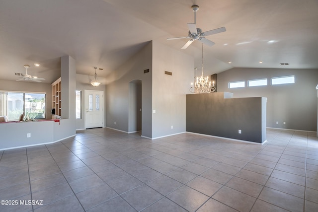 tiled empty room featuring ceiling fan with notable chandelier and high vaulted ceiling