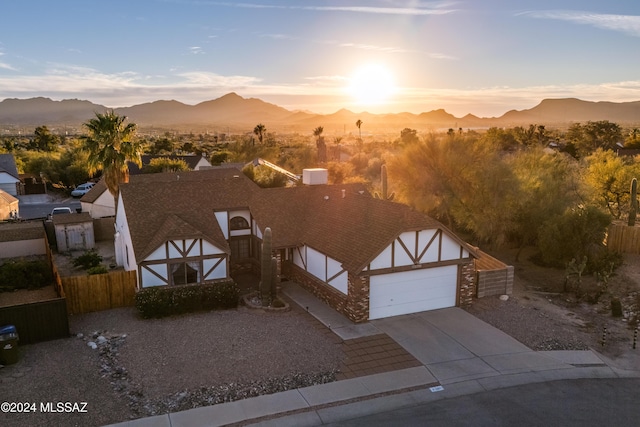 view of front of property with a mountain view and a garage