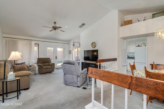 living room featuring french doors, light colored carpet, ceiling fan, and lofted ceiling